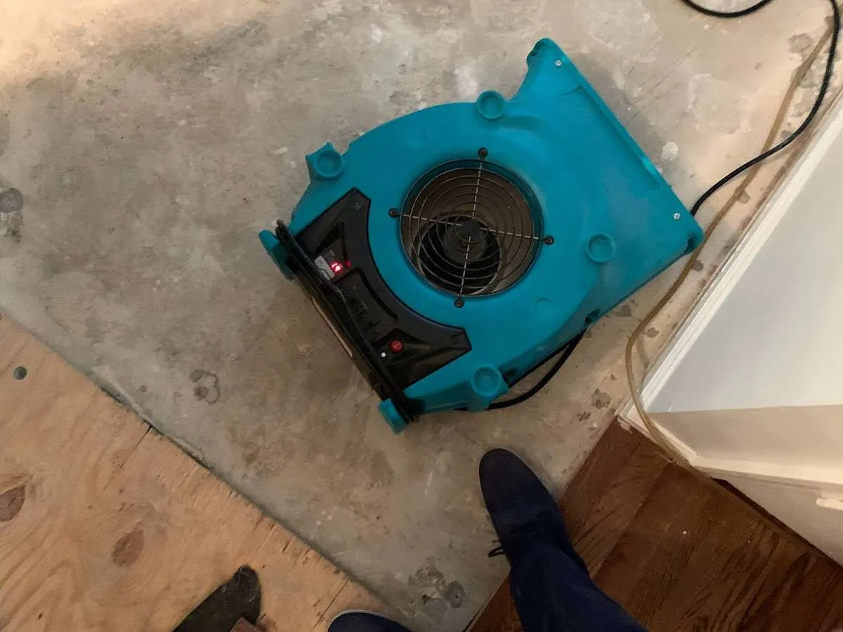 Air mover drying subfloor during Leak Detection & Repair in Grapevine
